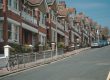 Row of UK homes, representing the impact of mortgage rate rises on borrowers