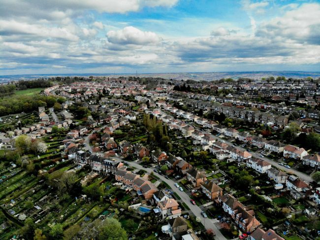 Aerial view of residential rooftops representing a buy-to-let property portfolio